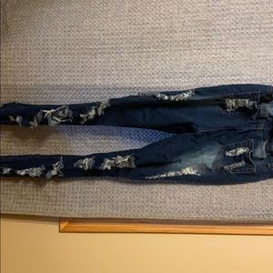 Dark blue ripped denim jeans